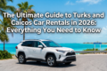 A white SUV rental car parked overlooking Grace Bay Beach in Providenciales, Turks and Caicos, featured in our ultimate 2026 driving guide.